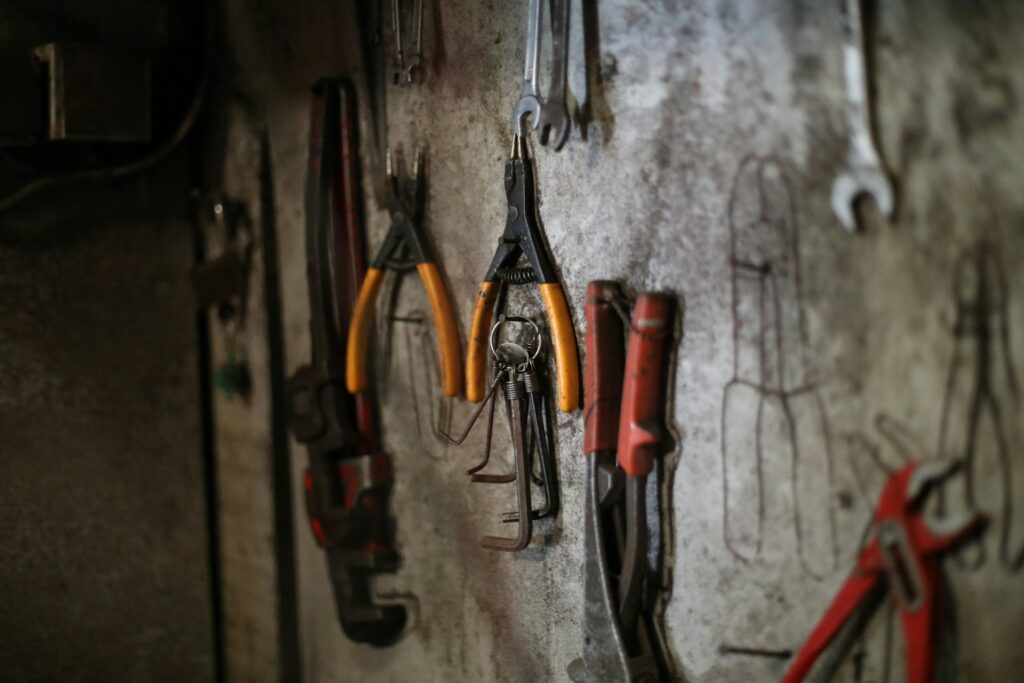 Assorted tools hanging on a workshop wall